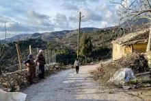 From Ahmetler village, bare hilltops that were scorched in the 2021 wildfires are visible in a distance