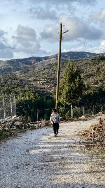 From Ahmetler village, bare hilltops that were scorched in the 2021 wildfires are visible in a distance